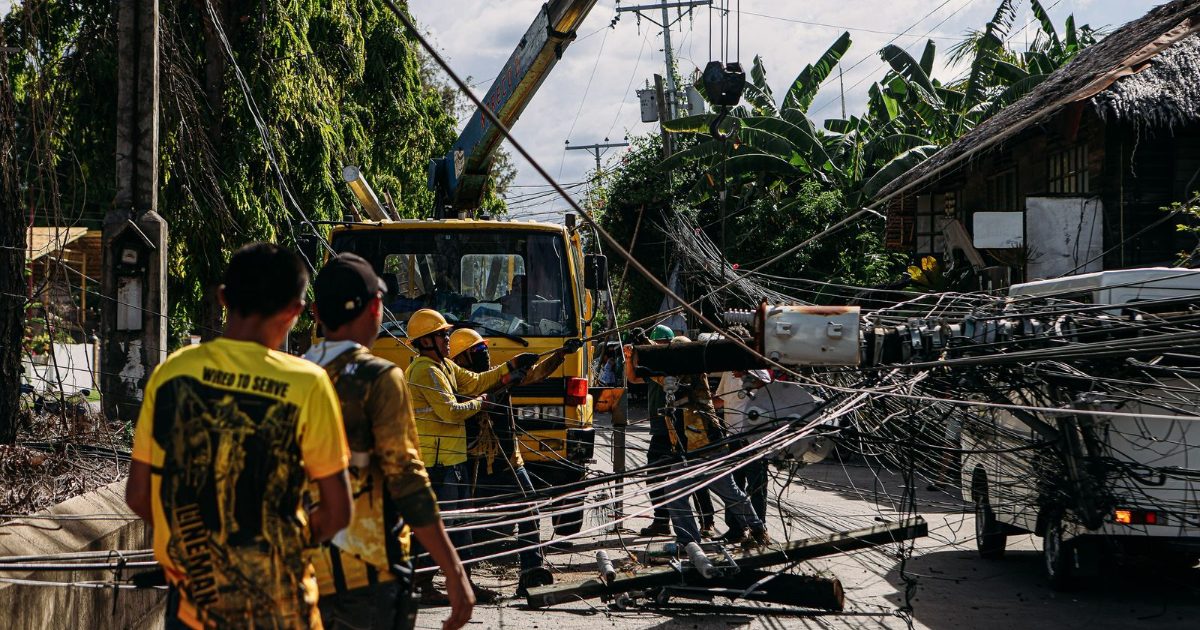 Utility crew repairing power lines after a storm knocked out electricity