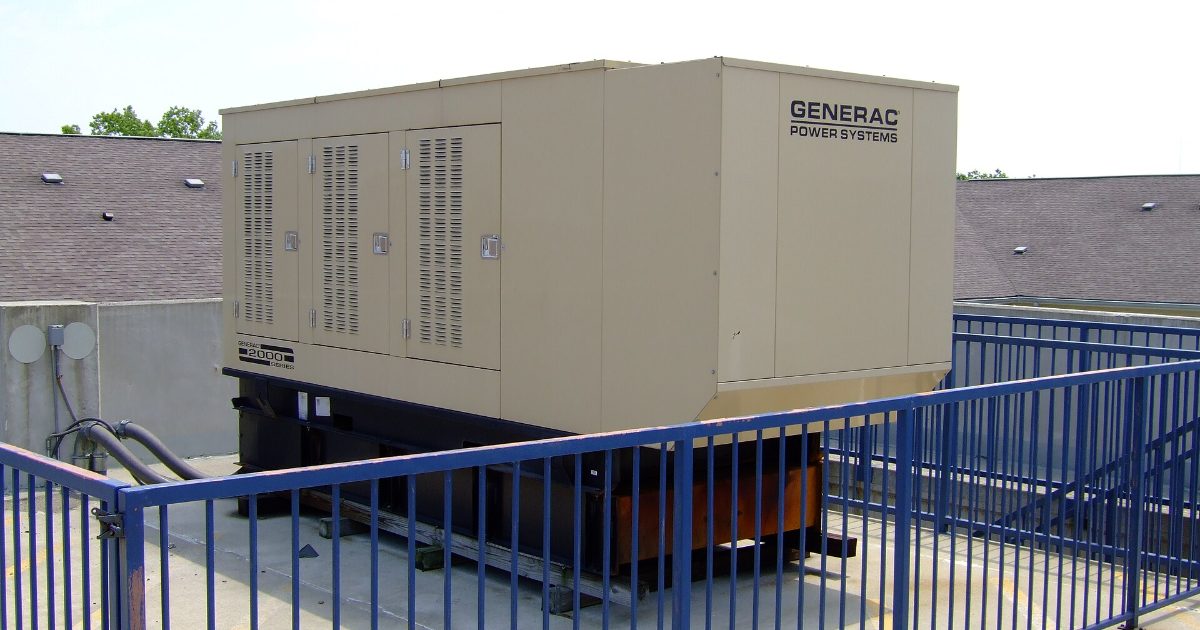 Generac standby generator installed behind a railing