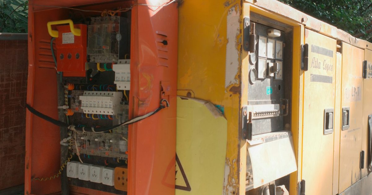 Generator with its electrical control panel open
