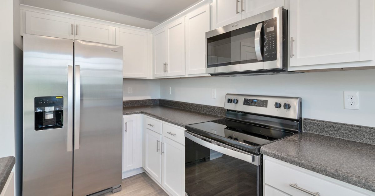 Kitchen with refrigerator and other appliances that add to generator load