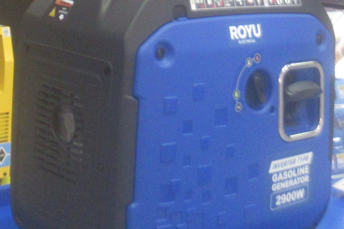 Portable gasoline generator with control panel and outlets