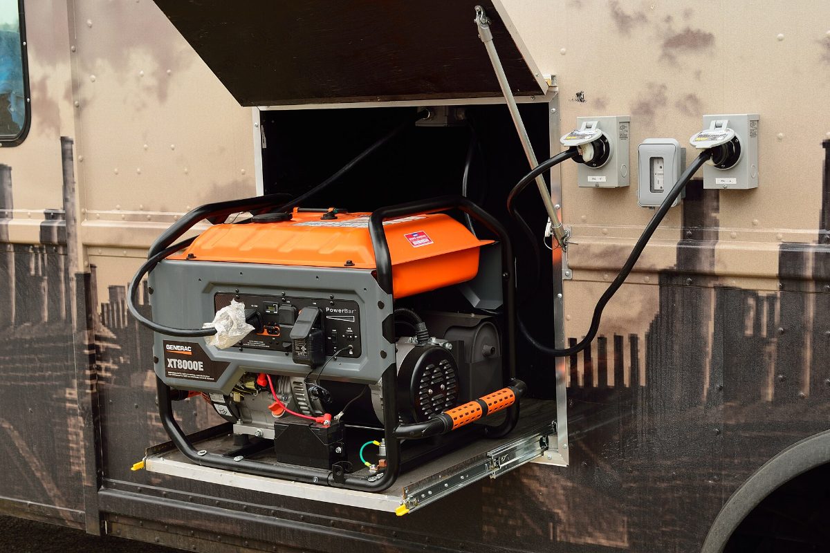Portable generator connected to a home power inlet box with a generator cord