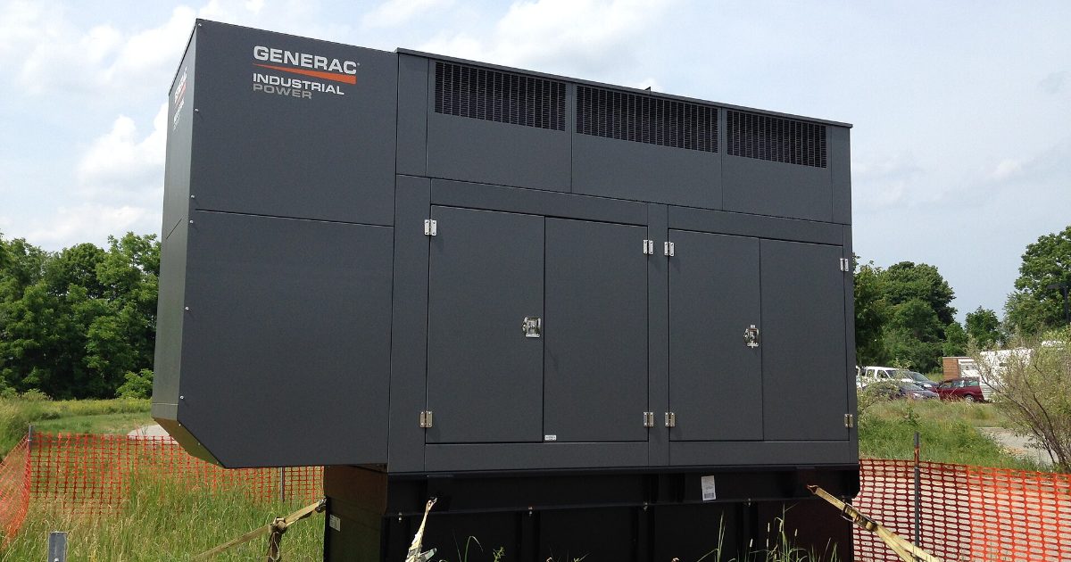 Large standby generator installed outdoors on a pad
